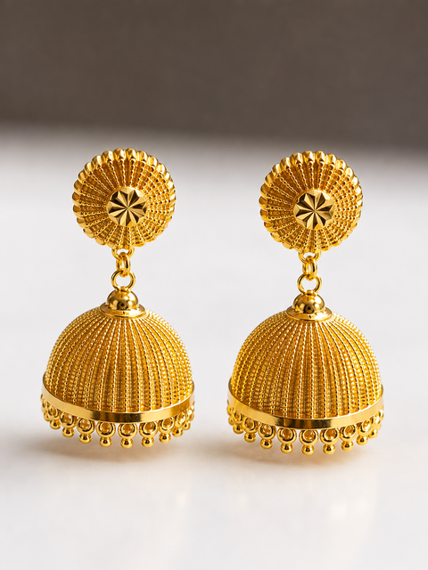 An illustration of a pair of jhimki — the bell-shaped Kerala earring, ribbed dome with a gold-bead fringe
